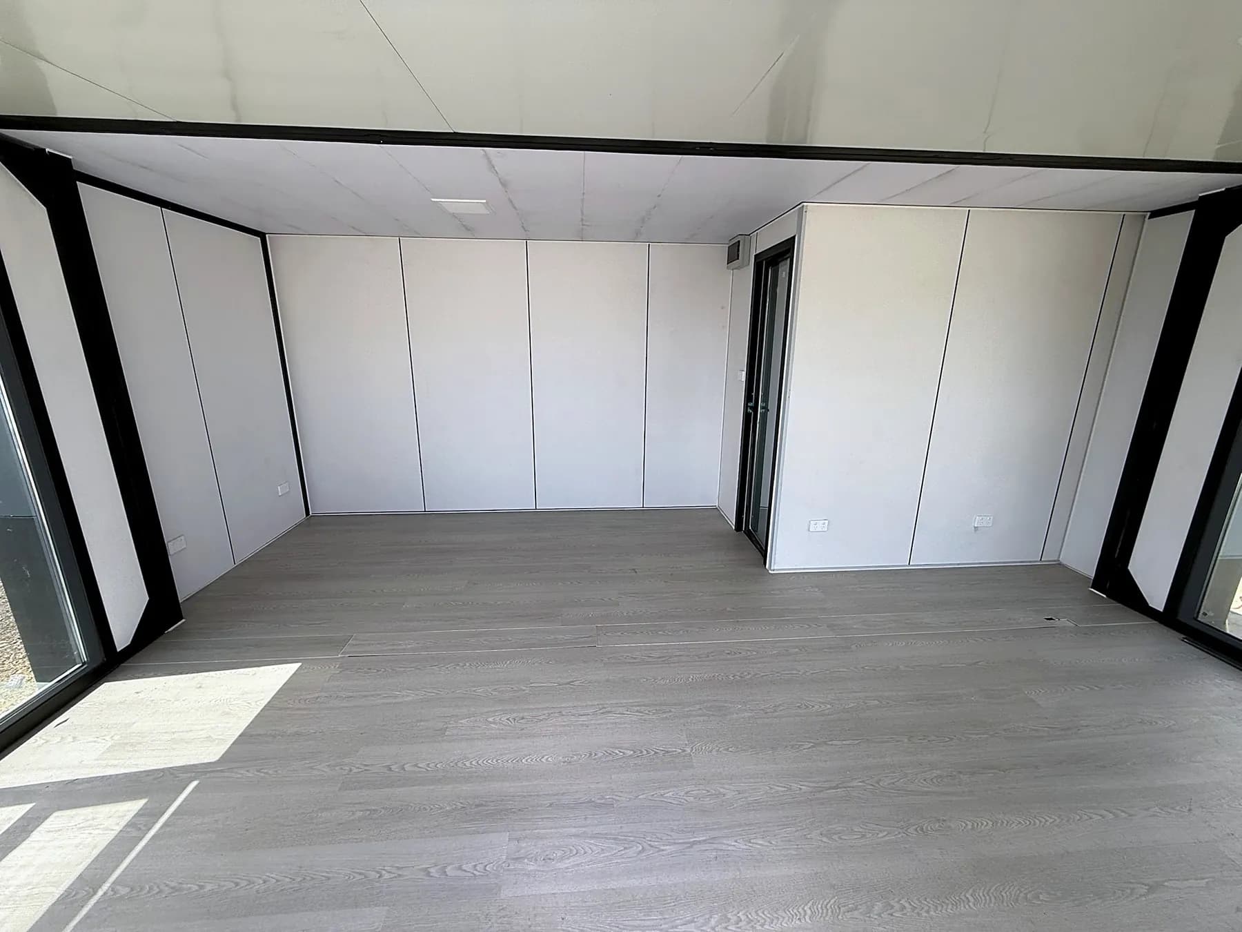 Empty Studio interior showing the wing beam and full-width floor