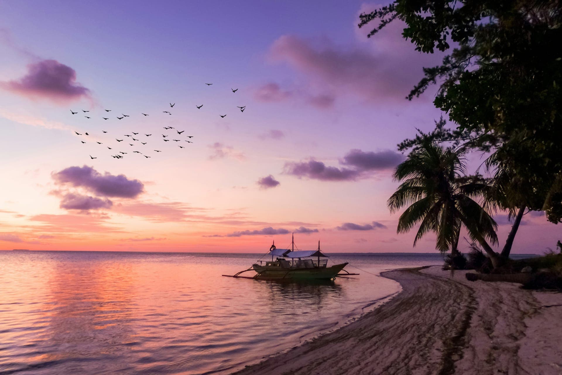 Scenic view of Pacific island mountains rising from clear blue water